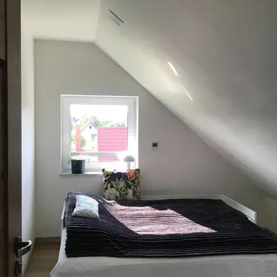Łóżko lub łóżka w pokoju w obiekcie Apartamenty iGrażka