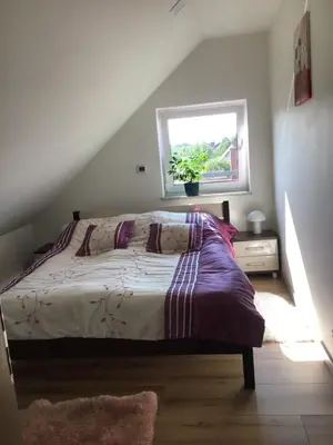 Łóżko lub łóżka w pokoju w obiekcie Apartamenty iGrażka