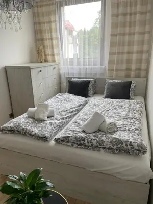 Łóżko lub łóżka w pokoju w obiekcie Magiczny apartament