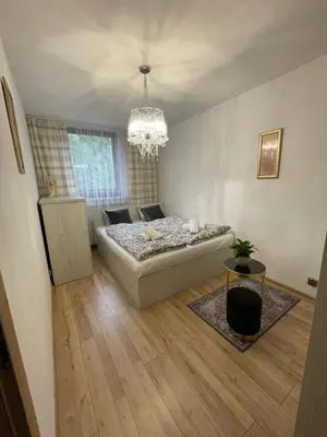 Łóżko lub łóżka w pokoju w obiekcie Magiczny apartament