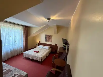Łóżko lub łóżka w pokoju w obiekcie Zatoka Leśna