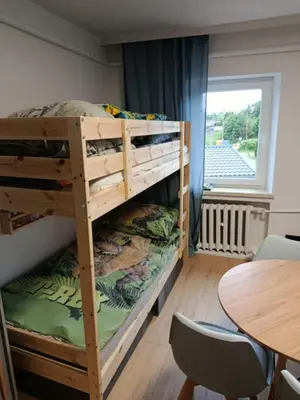Łóżko lub łóżka w pokoju w obiekcie Apartament Centrum