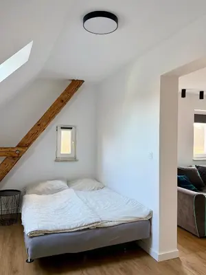 Łóżko lub łóżka w pokoju w obiekcie Apartament u Kuby z kącikiem zabaw