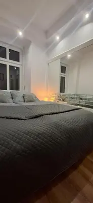 Łóżko lub łóżka w pokoju w obiekcie Apartament Antracyt