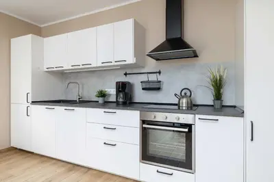 Kuchnia lub aneks kuchenny w obiekcie Apartment Gliwice near PreZero Arena with Parking&Balcony by Noclegi Renters