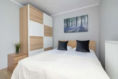 Łóżko lub łóżka w pokoju w obiekcie Apartment Gliwice near PreZero Arena with Parking&Balcony by Noclegi Renters