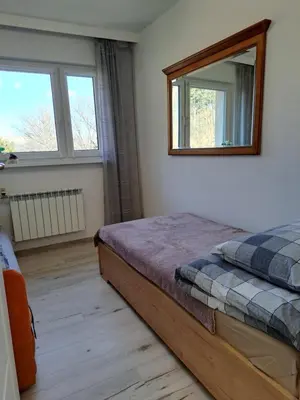 Łóżko lub łóżka w pokoju w obiekcie Apartament Zdrojowa 20, Duszniki Zdrój