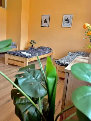 Łóżko lub łóżka w pokoju w obiekcie Robotnicza Przystań