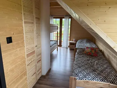 Łóżko lub łóżka w pokoju w obiekcie GóRSKA CHATA JAWOREK