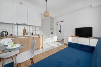 Telewizja i/lub zestaw kina domowego w obiekcie Indigo Apartment Wrocław by Solarento