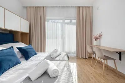 Łóżko lub łóżka w pokoju w obiekcie Indigo Apartment Wrocław by Solarento