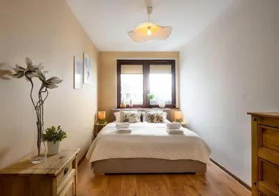 Łóżko lub łóżka w pokoju w obiekcie Świstackiego Comfort City Garden View - ProperUNIT
