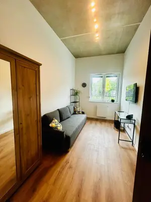 Łóżko lub łóżka w pokoju w obiekcie Apartamenty Balonowa