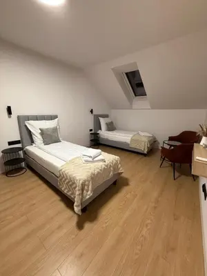 Łóżko lub łóżka w pokoju w obiekcie Jack Apartments- Apartamenty z garażem