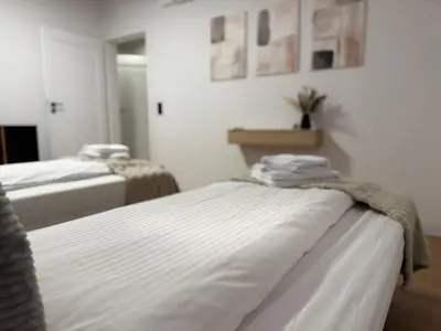 Łóżko lub łóżka w pokoju w obiekcie Jack Apartments- Apartamenty z garażem