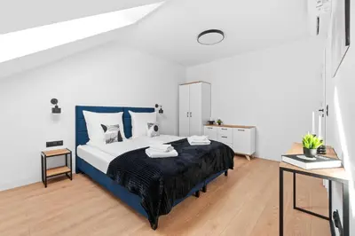 Łóżko lub łóżka w pokoju w obiekcie Jack Apartments- Apartamenty z garażem