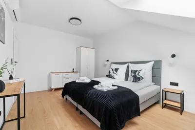 Łóżko lub łóżka w pokoju w obiekcie Jack Apartments- Apartamenty z garażem