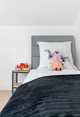 Łóżko lub łóżka w pokoju w obiekcie Jack Apartments- Apartamenty z garażem