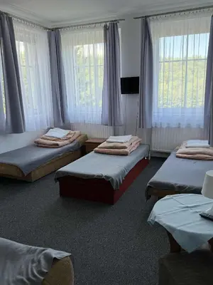 Łóżko lub łóżka w pokoju w obiekcie Ośrodek Skałka