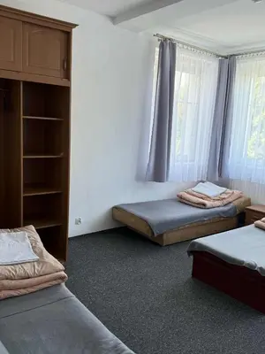 Łóżko lub łóżka w pokoju w obiekcie Ośrodek Skałka