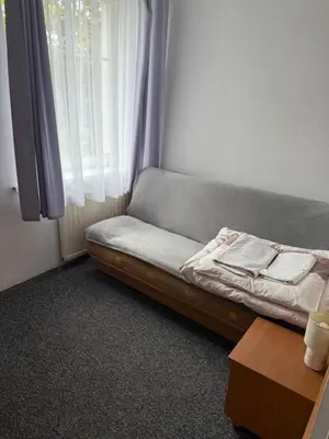 Łóżko lub łóżka w pokoju w obiekcie Ośrodek Skałka