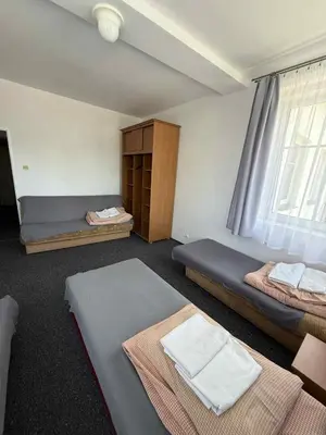 Łóżko lub łóżka w pokoju w obiekcie Ośrodek Skałka