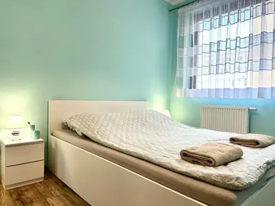 Łóżko lub łóżka w pokoju w obiekcie Marcinowska 2 Apartment - Self check-in 20h - parking