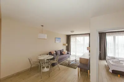 Łóżko lub łóżka w pokoju w obiekcie VacationClub - BORMIO Apartament 29