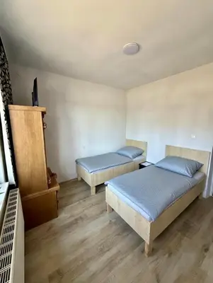 Łóżko lub łóżka w pokoju w obiekcie Pokoje na wynajem Rybnik Rudzka