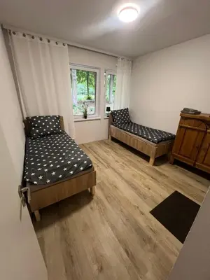 Łóżko lub łóżka w pokoju w obiekcie Pokoje na wynajem Rybnik Rudzka