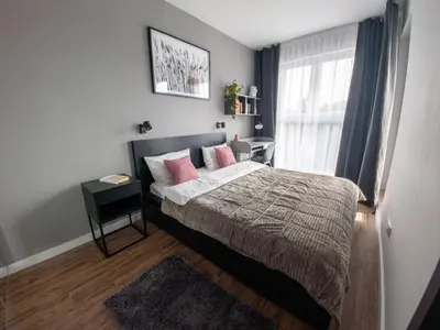 Łóżko lub łóżka w pokoju w obiekcie Apartament Lemon