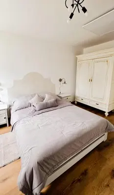 Łóżko lub łóżka w pokoju w obiekcie Apartament Antracytowe Wrota 2