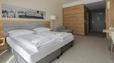 Łóżko lub łóżka w pokoju w obiekcie VacationClub - Aparthotel Czarna Góra Apartament 239