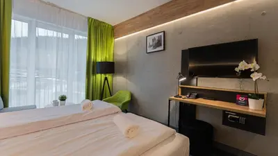 Łóżko lub łóżka w pokoju w obiekcie VacationClub - Czarna Perła Apartament 201