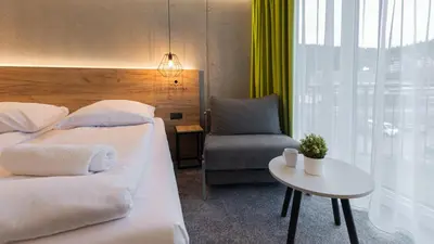 Łóżko lub łóżka w pokoju w obiekcie VacationClub - Czarna Perła Apartament 201
