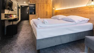 Łóżko lub łóżka w pokoju w obiekcie VacationClub - Czarna Perła Apartament 201