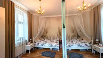 Łóżko lub łóżka w pokoju w obiekcie Vintage Apartment vis-à-vis Park Tower