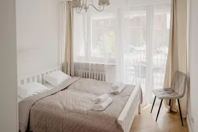 Łóżko lub łóżka w pokoju w obiekcie Wita Stwosza Rynek Apartament Wrocław