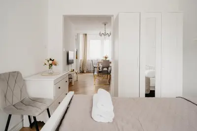 Łóżko lub łóżka w pokoju w obiekcie Wita Stwosza Rynek Apartament Wrocław