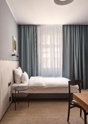 Łóżko lub łóżka w pokoju w obiekcie Wroclaw Hotel