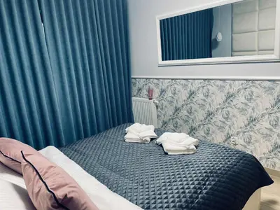 Łóżko lub łóżka w pokoju w obiekcie Apartament NATALKA SPA ul Traugutta