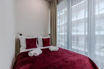 Łóżko lub łóżka w pokoju w obiekcie River Premium Apartment D