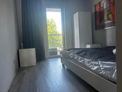 Łóżko lub łóżka w pokoju w obiekcie Komfortowe Apartamenty Nad Odrą
