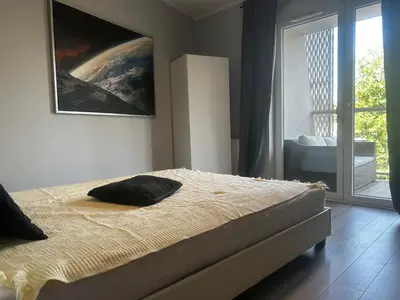 Łóżko lub łóżka w pokoju w obiekcie Komfortowe Apartamenty Nad Odrą