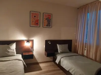 Łóżko lub łóżka w pokoju w obiekcie Hotelik pod Baranami