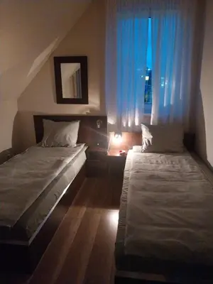 Łóżko lub łóżka w pokoju w obiekcie Hotelik pod Baranami