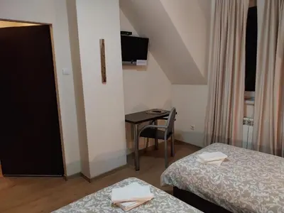 Łóżko lub łóżka w pokoju w obiekcie Hotelik pod Baranami