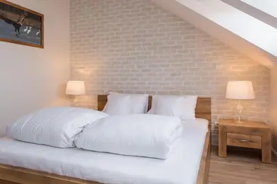 Łóżko lub łóżka w pokoju w obiekcie Hotel Naturum