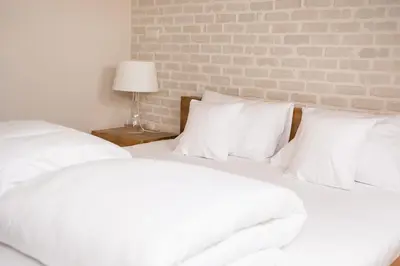 Łóżko lub łóżka w pokoju w obiekcie Hotel Naturum