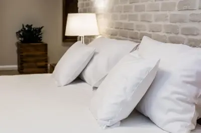 Łóżko lub łóżka w pokoju w obiekcie Hotel Naturum
